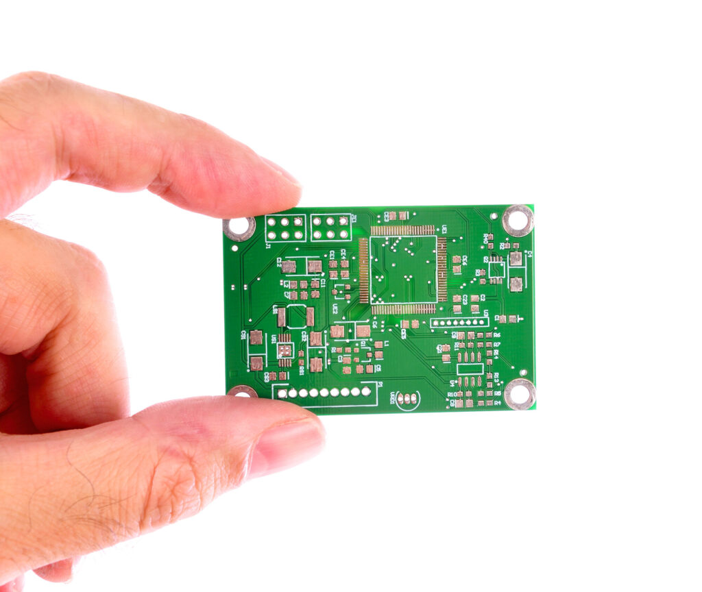 PCB clasped between fingers